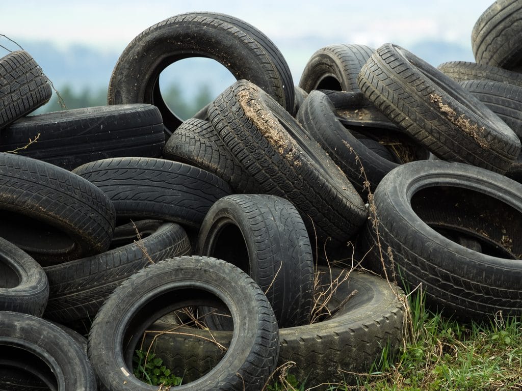IVORY COAST: Basétégé Kamagaté gives old car tyres new air ®TOM KAROLA/Shutterstook